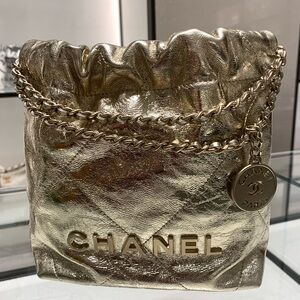 Brand new, limited edition rare /collectible authentic Lancôme Chanel gold purse